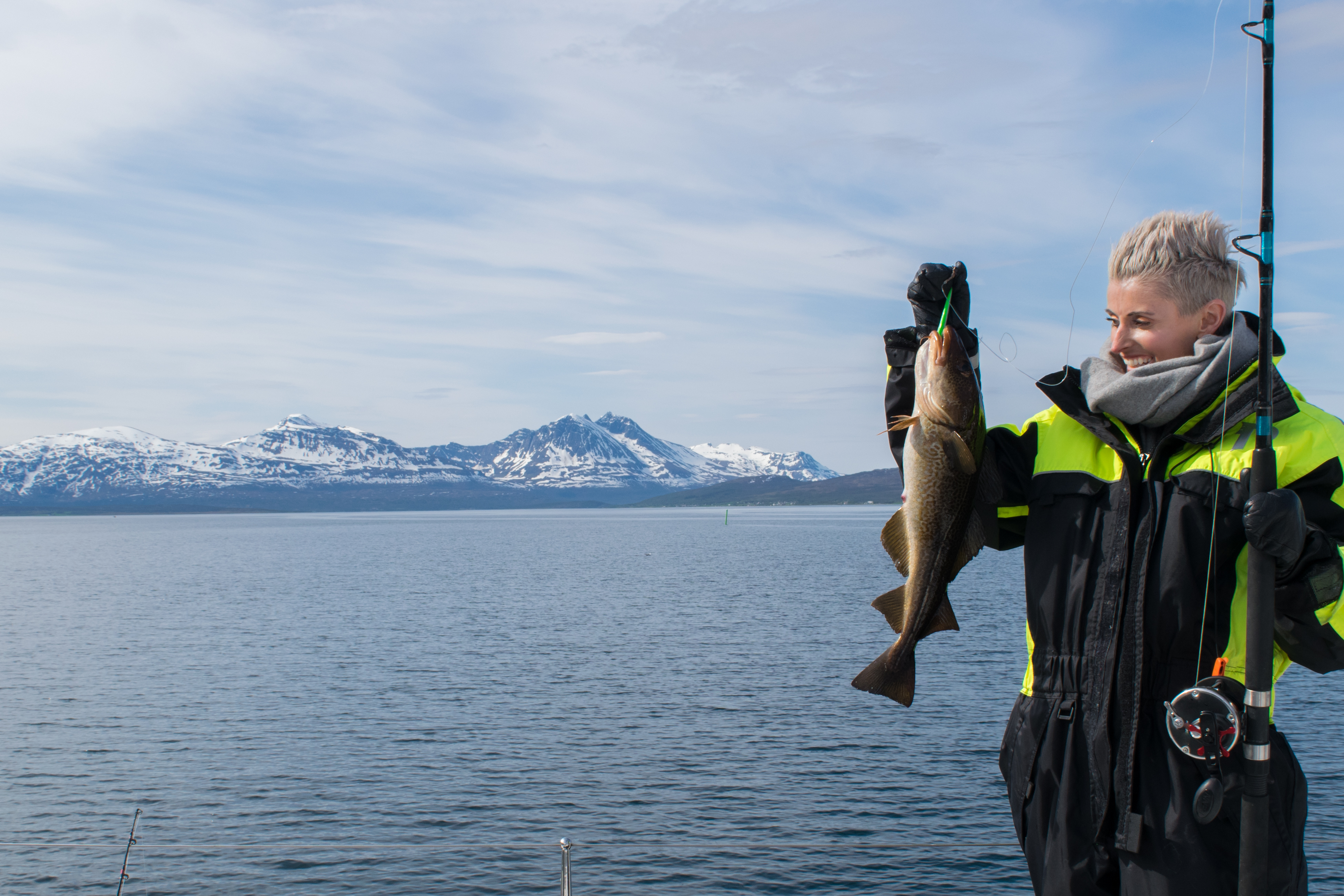 Beautiful girl fishing in northern Norway