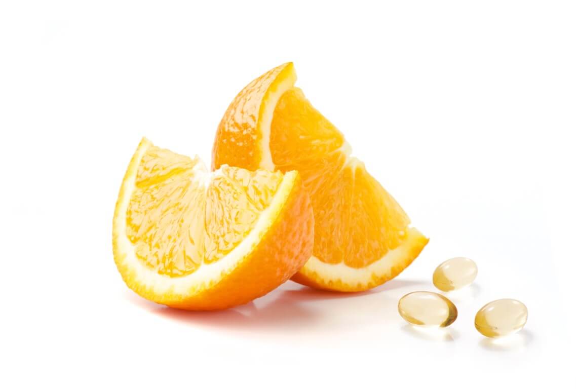 Image of omega-3 fish oil supplement pills and orange slices